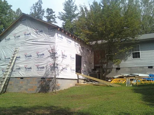Tyvek wrapped gable on a new room addition beside an existing home in Dover Plains
